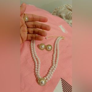 This is full set of jewelry including necklace, earrings and a ring.